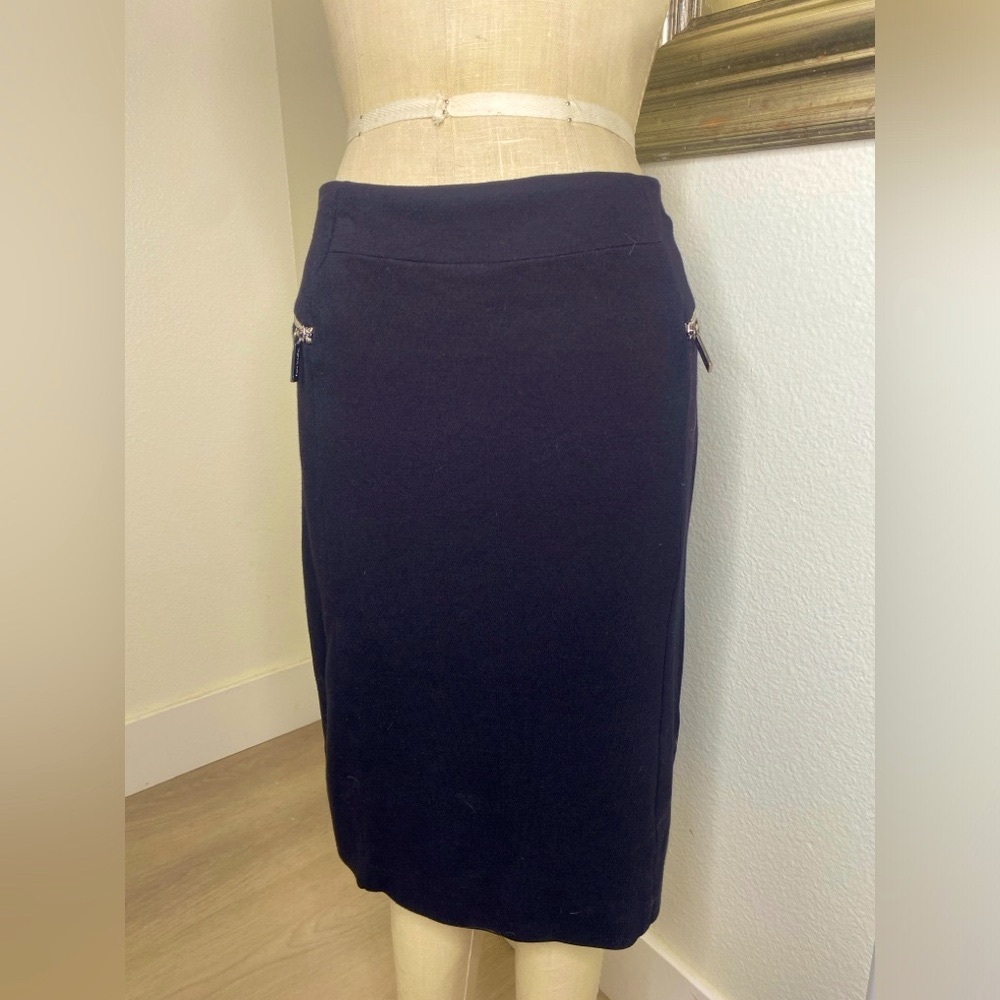 Michael Kors black skirt. Zipper back 2 zippers on front as decorative elements.